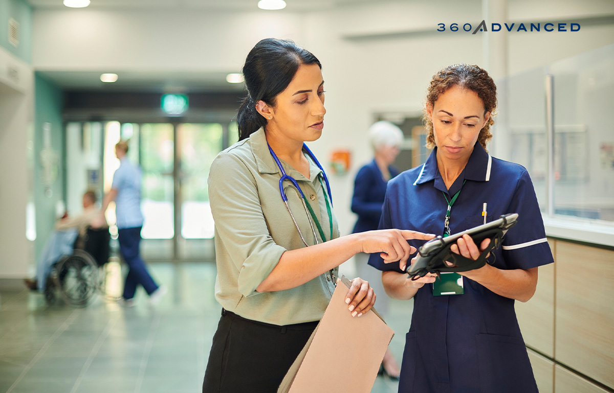 Healthcare employees checking medical records on tablet