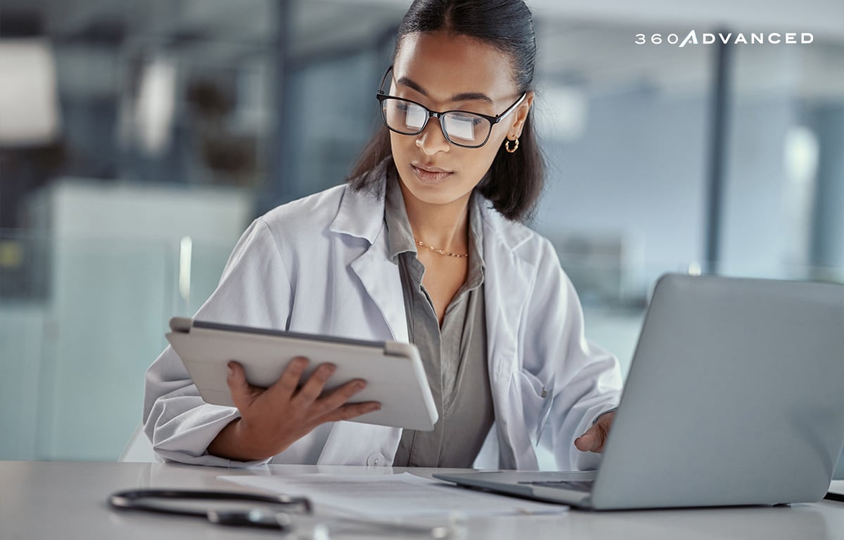 Image of doctor using a digital tablet at work