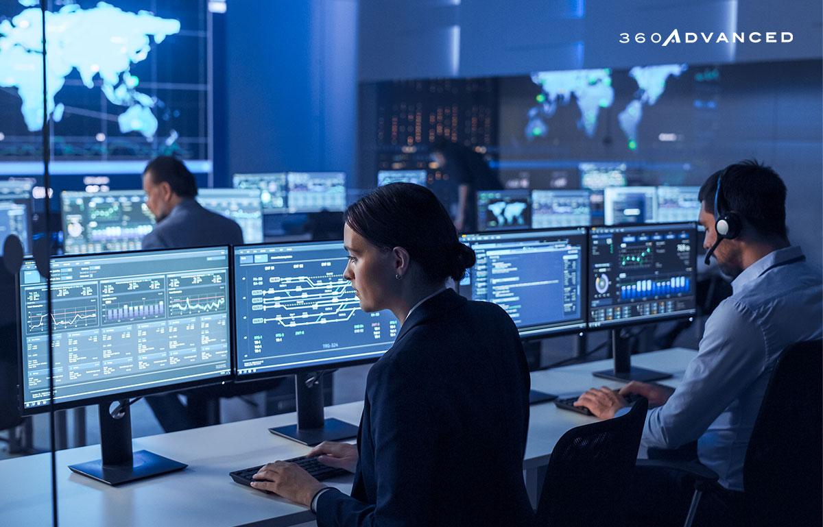 Team of Computer Data Science Engineers Working on Desktops with Screens Showing Charts, Graphs, Infographics, maps, and Statistics in a Dark Control and Monitoring Room